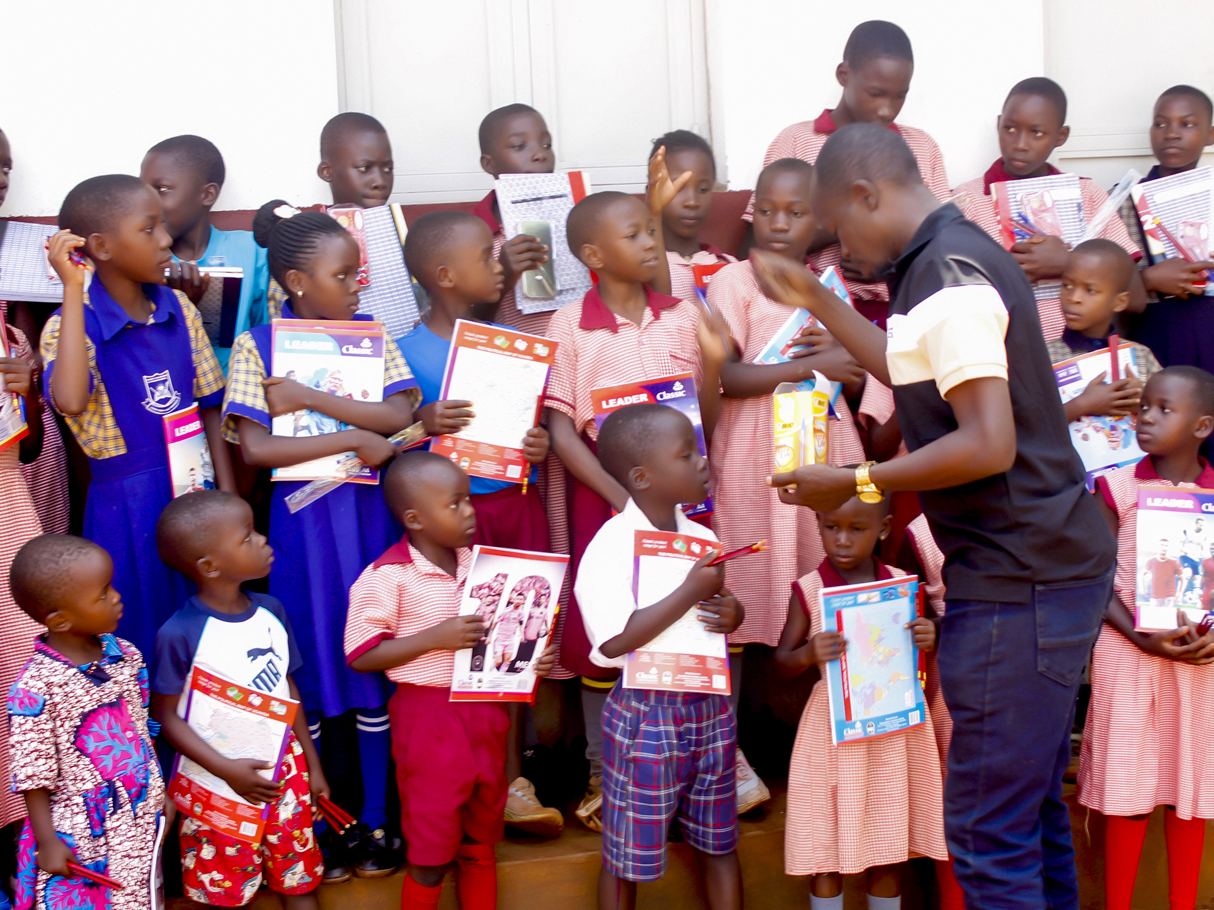 Children receiving school supplies